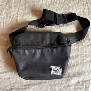 Herschel Fifteen hip pack/fanny pack in black sparkle and candy stripe inside